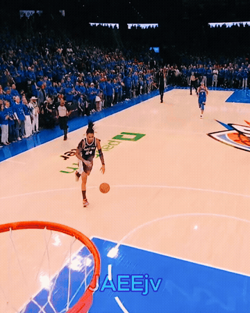 a basketball player is dribbling a ball on a court with the word jaeev written on the bottom