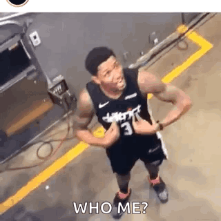 A Basketball Player Is Giving A Thumbs Up In A Parking Lot And Asking Who Me ? GIF