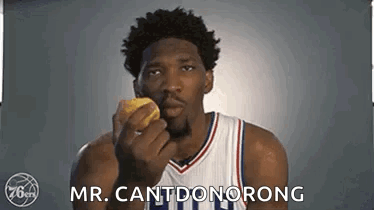 A Basketball Player Is Holding A Donut In His Hand And Says `` Mr. Cantdonorong '' . GIF