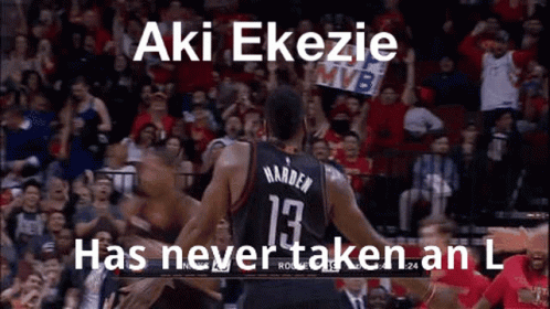 A Basketball Player Is Hugging Another Player On The Court While A Crowd Watches . GIF