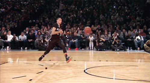 A Basketball Player Is Jumping In The Air While Wearing A Black Jersey With The Number 1 On It GIF