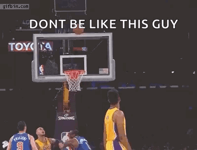 A Basketball Player Is Jumping In The Air With His Arms Outstretched In Front Of A Basketball Net . GIF