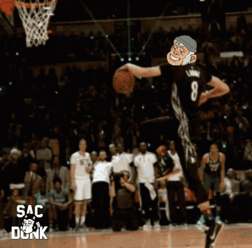 A Basketball Player Is Jumping In The Air With The Number 8 On His Jersey GIF
