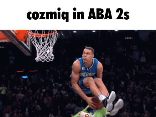 A Basketball Player Is Jumping In The Air With The Words Cozmiq In Aba 2S Below Him GIF