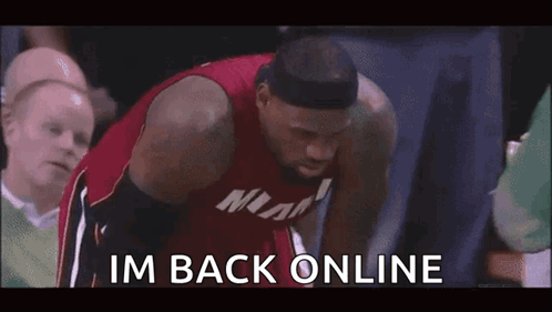 A Basketball Player Is Kneeling Down And Saying `` Im Back Online '' GIF