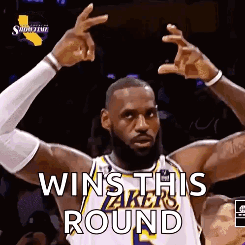 A Basketball Player Is Making A Victory Sign With His Hands . GIF
