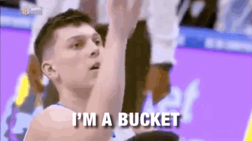 A Basketball Player Is Saying I 'M A Bucket While Holding A Basketball . GIF