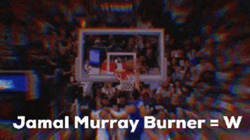 A Basketball Player Is Standing In Front Of A Crowd Of People . GIF