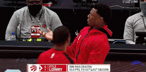 A Basketball Player Named Kyle Lowry Is Talking To Another Man GIF