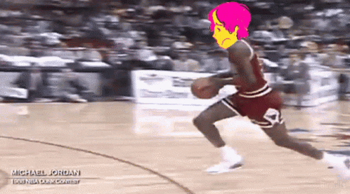 A Basketball Player Named Michael Jordan Is Dribbling A Basketball On A Court GIF