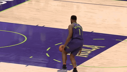 A Basketball Player Named Williamson Is Kneeling Down On The Court GIF