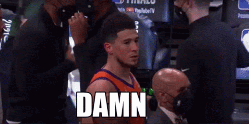 A Basketball Player Standing In A Locker Room With The Word Damn Written On The Screen GIF