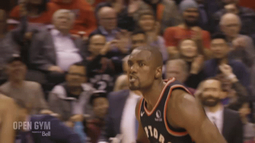 A Basketball Player Stands In Front Of A Crowd With The Words Open Gym Bell On The Bottom Right GIF