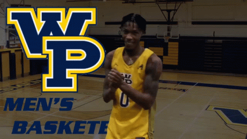 A Basketball Player Stands On A Court In Front Of A Banner That Says Men 'S Baskete GIF