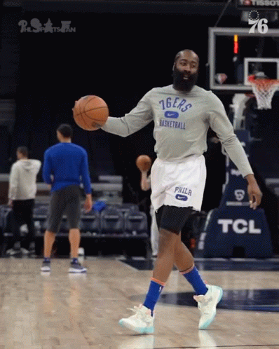 A Basketball Player Wearing A 76Ers Shirt Holds A Basketball GIF