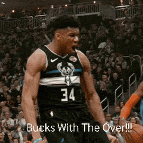 A Basketball Player Wearing A Black Jersey With The Number 34 On It GIF
