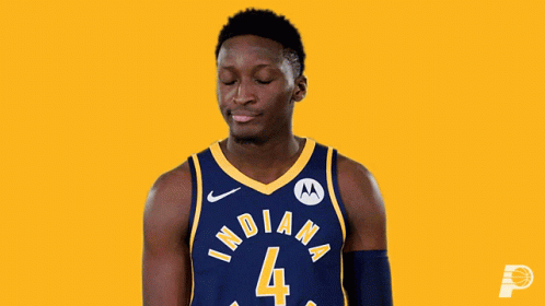 A Basketball Player Wearing A Blue And Yellow Indiana Jersey GIF