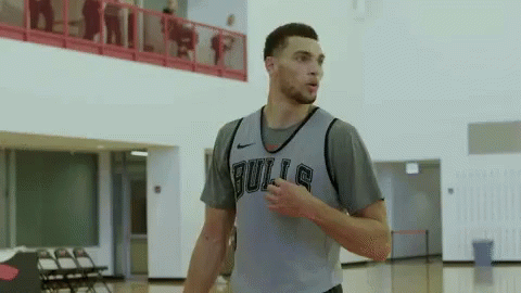 A Basketball Player Wearing A Bulls Jersey Stands On A Court GIF