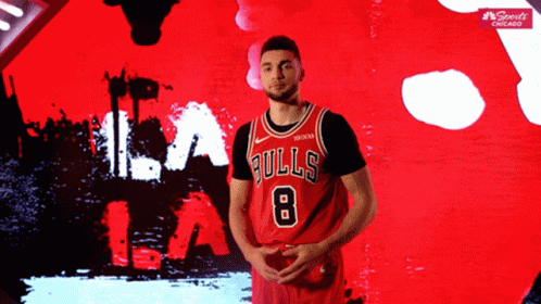 A Basketball Player Wearing A Bulls Jersey With The Number 8 On It GIF