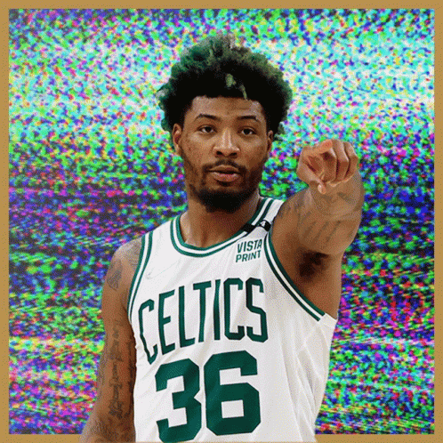 A Basketball Player Wearing A Celtics Jersey Pointing GIF