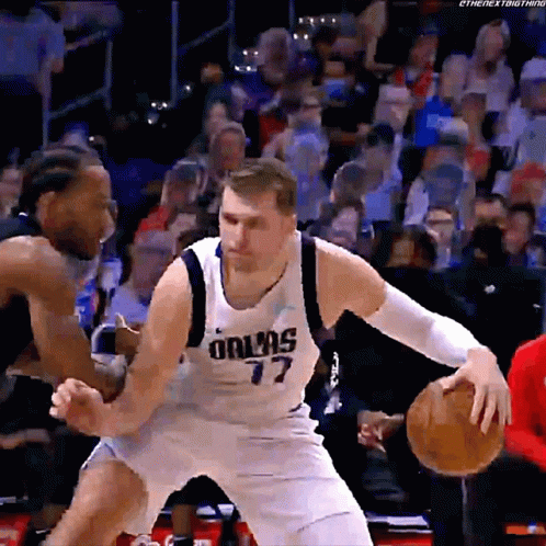 A Basketball Player Wearing A Dallas 77 Jersey GIF