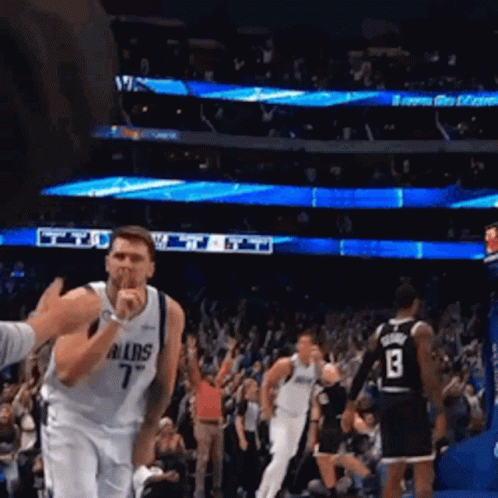 A Basketball Player Wearing A Dallas Jersey Covering His Mouth GIF