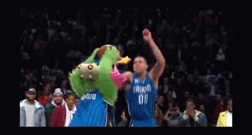 A Basketball Player Wearing A Dallas Jersey Is Going For A Dunk GIF