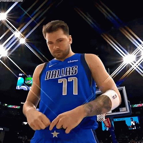 A Basketball Player Wearing A Dallas Jersey With The Number 77 On It GIF