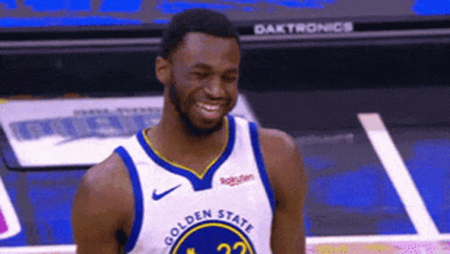 A Basketball Player Wearing A Golden State Jersey Smiles On The Court GIF