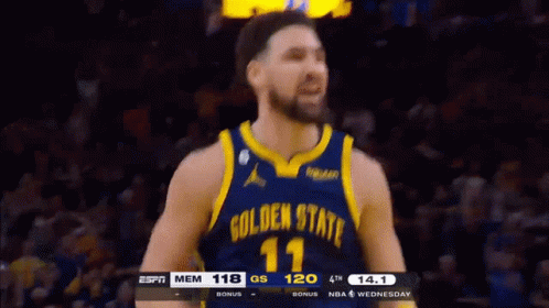 A Basketball Player Wearing A Golden State Warriors Uniform GIF