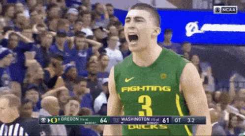 A Basketball Player Wearing A Green Jersey That Says Fighting 3 GIF