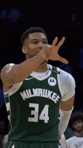 A Basketball Player Wearing A Green Milwaukee Jersey Number 34 GIF