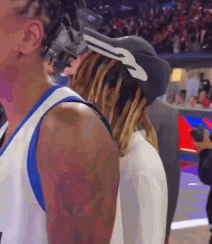 A Basketball Player Wearing A Hat With A Key On It GIF