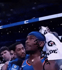 A Basketball Player Wearing A Headband And A Gatorade Shirt GIF