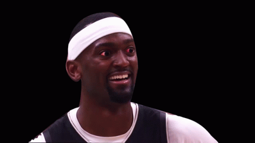 A Basketball Player Wearing A Headband And Smiling With Red Eyes GIF