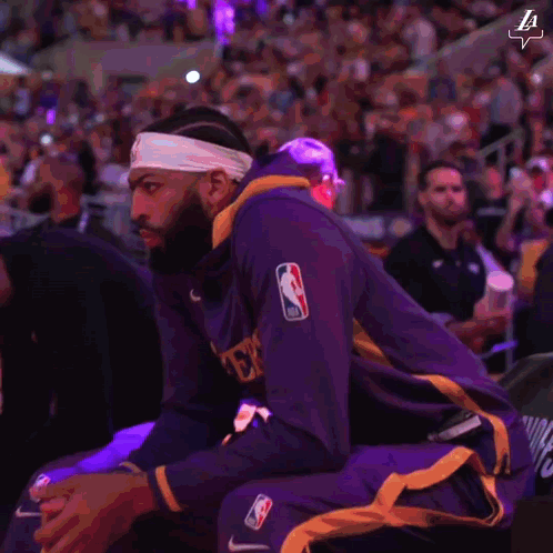 A Basketball Player Wearing A Headband That Says La On It GIF