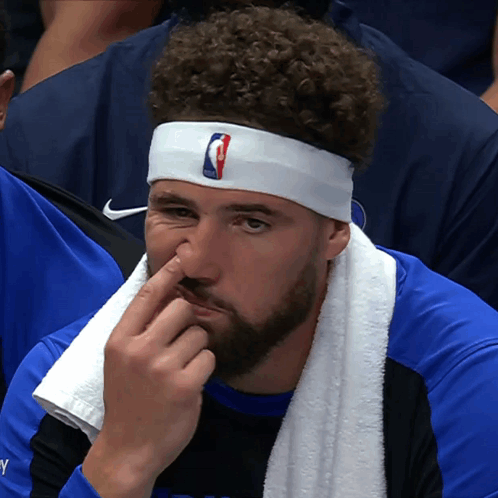 A Basketball Player Wearing A Headband With The Nba Logo GIF