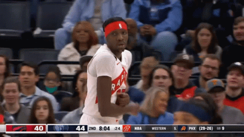 A Basketball Player Wearing A Headband With The Word Raptors On It Stands In Front Of A Crowd GIF