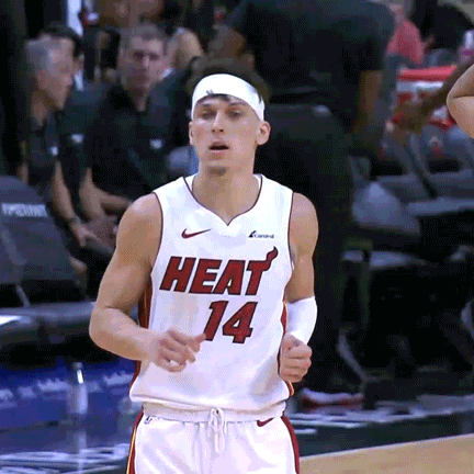 A Basketball Player Wearing A Heat 14 Jersey Runs On The Court GIF