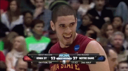 a basketball player wearing a iowa state jersey is smiling in front of a crowd
