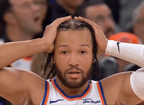 A Basketball Player Wearing A Jersey That Says Abu Dhabi On It GIF