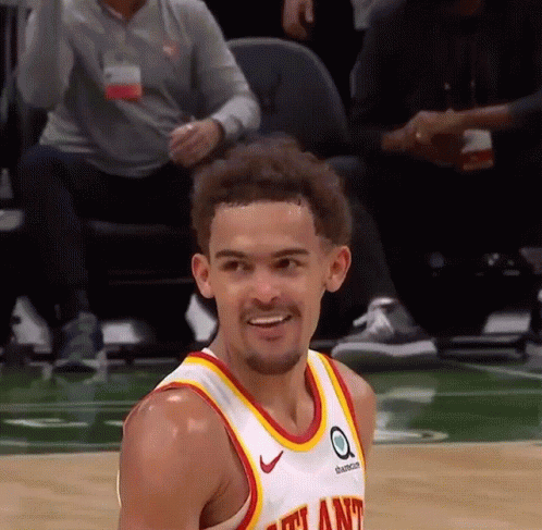 A Basketball Player Wearing A Jersey That Says Atlanta Is Smiling GIF