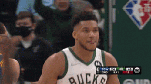 A Basketball Player Wearing A Jersey That Says Buck On It GIF