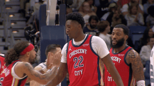 A Basketball Player Wearing A Jersey That Says Crescent City GIF