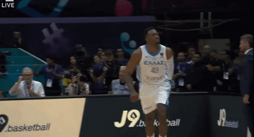 A Basketball Player Wearing A Jersey That Says Eaas On It GIF