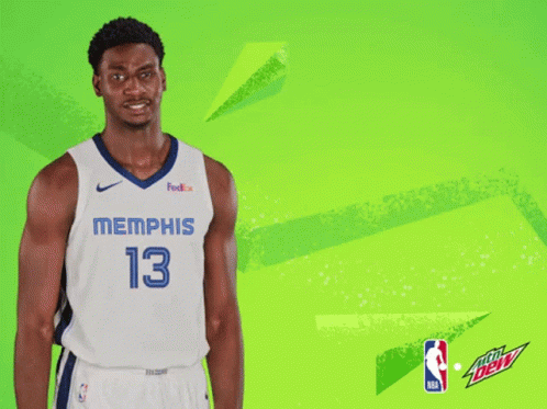 A Basketball Player Wearing A Jersey That Says Memphis 13 On It GIF