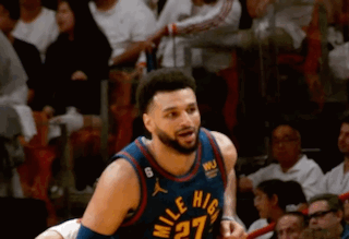 A Basketball Player Wearing A Jersey That Says Mile High On It GIF