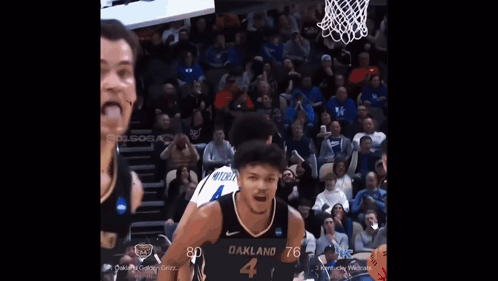 a basketball player wearing a jersey that says oakland 3