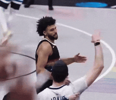 A Basketball Player Wearing A Jersey That Says Oklahoma Is Hugging Another Player GIF