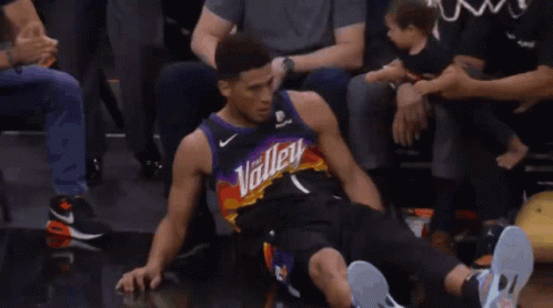 A Basketball Player Wearing A Jersey That Says " Phoenix " On It GIF